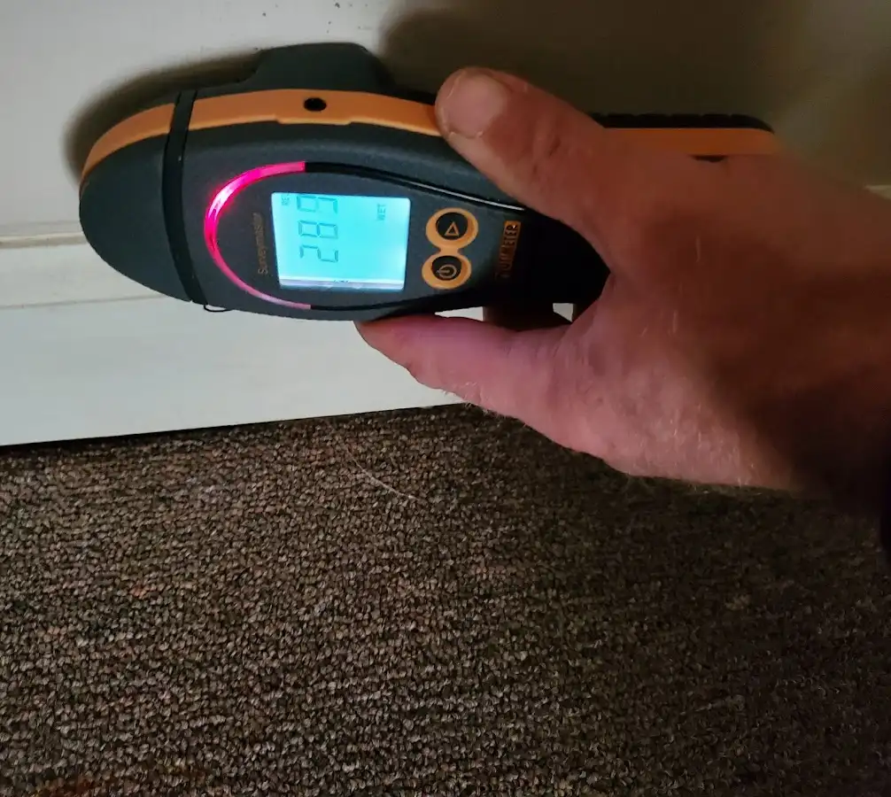 Moisture detection at baseboard during Burst Pipe Cleanup in North Bay Village